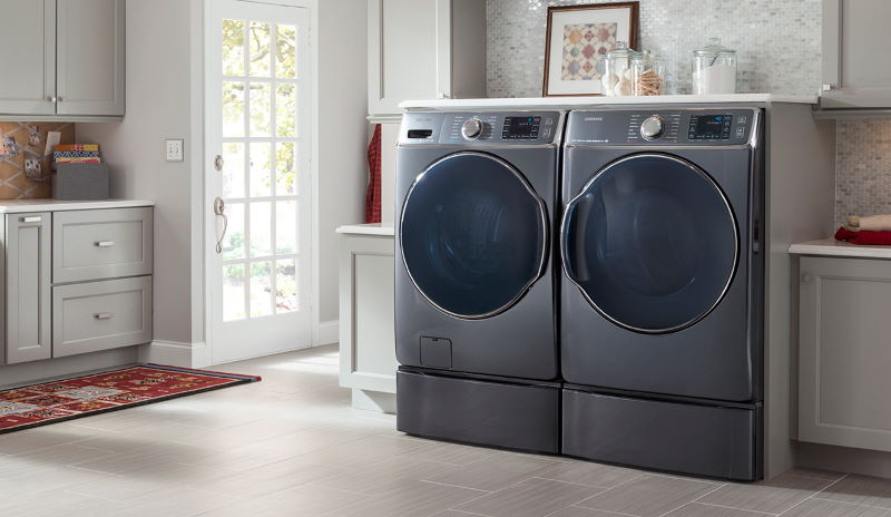 Modern laundry room with sleek front-loading washer and dryer.